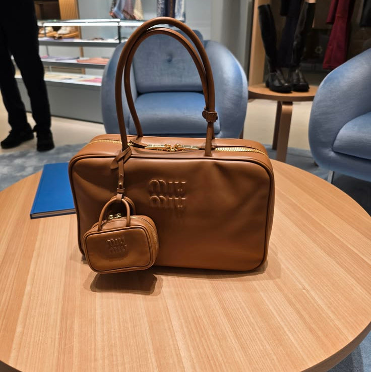 Miu Miu Beau collection, paired with a matching micro-bag charm