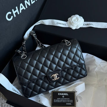 Chanel Classic Double Flap Bag in black caviar leather with silver-tone hardware.