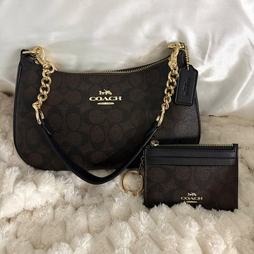Coach Teri Shoulder Bag in Signature Canvas paired with a matching small card case or wallet