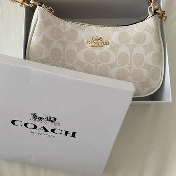 Coach Teri Shoulder Bag in Signature Canvas in a light beige/cream colorway