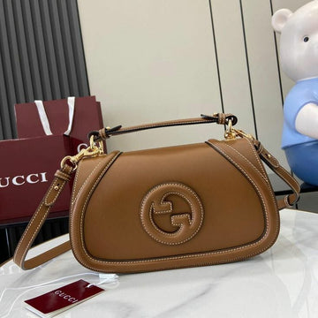 Gucci Blondie Small Top Handle Bag in brown leather.