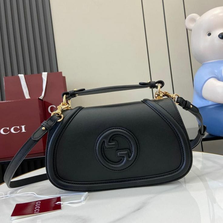 Gucci Blondie Small Top Handle Bag featuring the debossed round Interlocking G logo