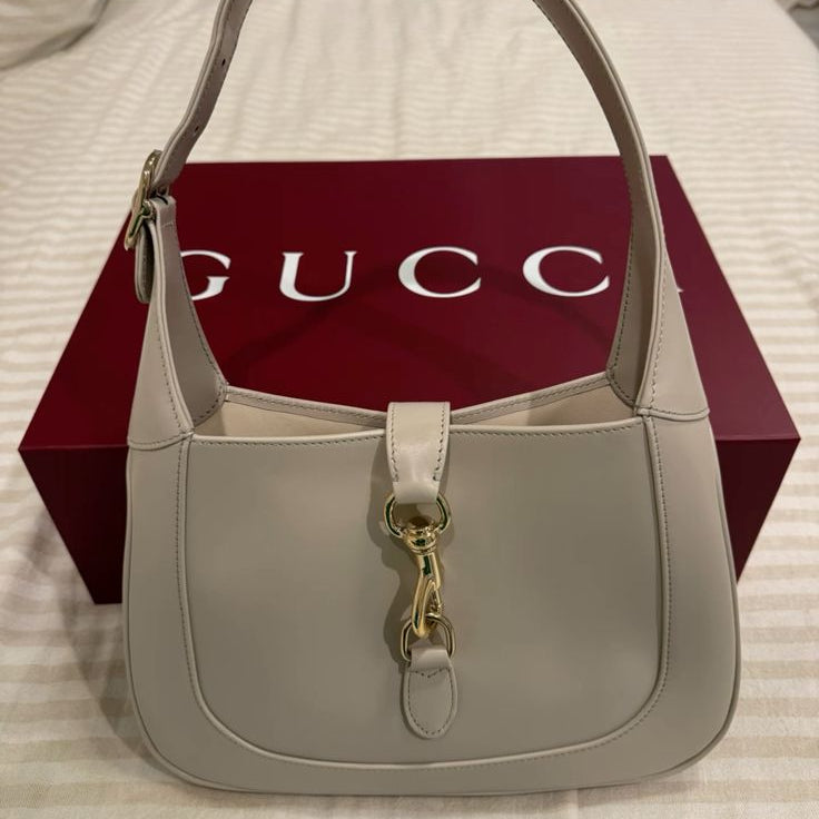 Gucci Jackie 1961 Small Shoulder Bag featuring the line's signature gold-tone piston lock closure