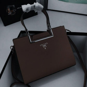 Prada handbag featuring silver-tone hardware and the iconic Prada triangle logo