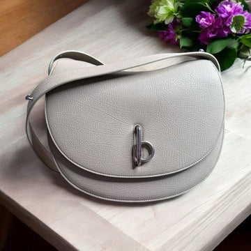 Burberry Rocking Horse Bag in a neutral/hunter colorway.
