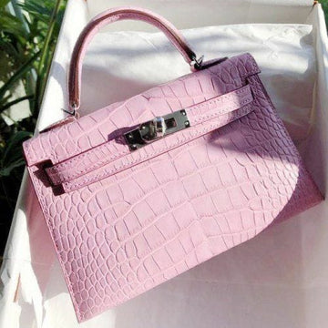 pink Hermès Mini Kelly Sellier bag crafted from exotic matte alligator leather with palladium hardware