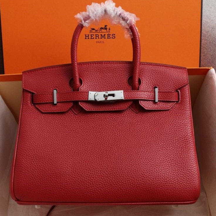 Red Hermès Birkin handbag crafted from grained leather with palladium (silver-tone) hardware
