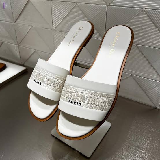 Christian Dior Dway Slides crafted from calfskin and embroidered cotton