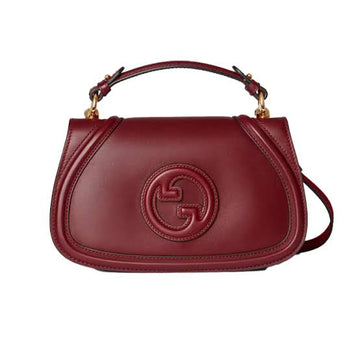 Gucci Blondie Medium Top Handle Bag in burgundy (Rosso Ancora) leather.