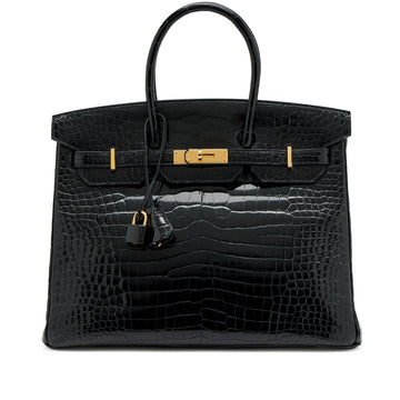 Hermès Birkin Bag crafted in black shiny exotic crocodile leather with gold-tone hardware